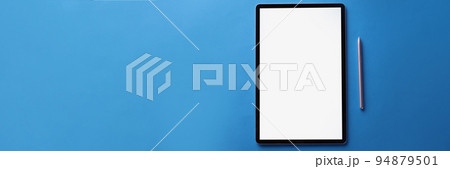 Set of black screen modern tablet device with reflection and silver pen on blue surface 94879501