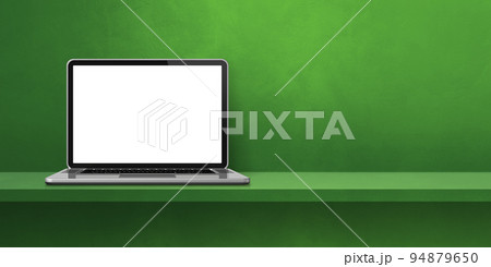 Laptop computer on green shelf background banner 94879650