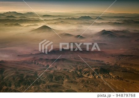 Aerial Atacama desert, snowcapped volcanoes and arid landscape in Chile 94879768