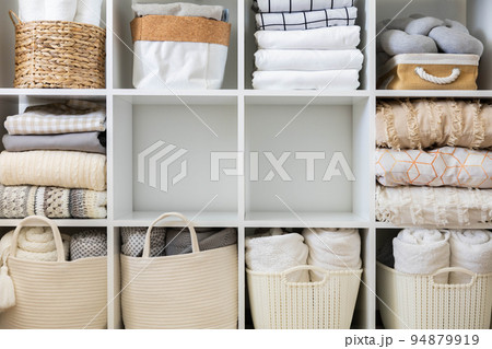 Bed linens closet neatly arrangement on shelves with copy space domestic textile Nordic minimalism 94879919