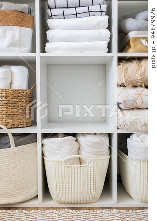 Bed linens closet neatly arrangement on shelves with copy space domestic textile Nordic minimalism 94879926