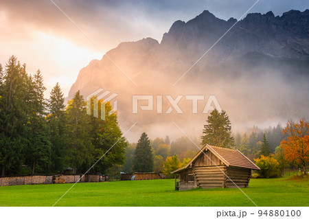 Bavarian alps autumn and wooden barn at sunset, Garmisch Partenkirchen, Germany 94880100