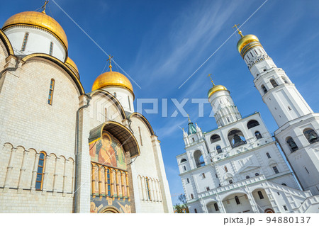 Kremlin cathedral with golden domes at peaceful sunrise, Moscow, Russia 94880137