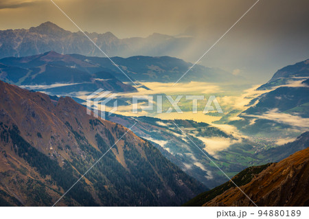 Misty valley from above Grossglockner and mountain landscape at dawn, Austria 94880189
