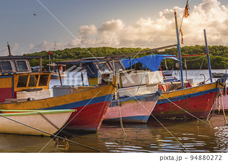 Bay at sunset with fishing trawler rustic boats in Porto Seguro, BAHIA, Brazil 94880272