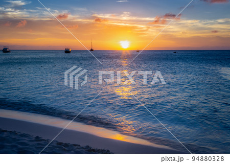 Aruba idyllic caribbean beach with boats at sunset, Dutch Antilles Sea 94880328