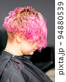 Beautiful young pink haired caucasian woman in the modern hair salon 94880539
