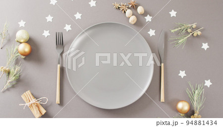 Image of christmas place setting with cutlery on grey background 94881434