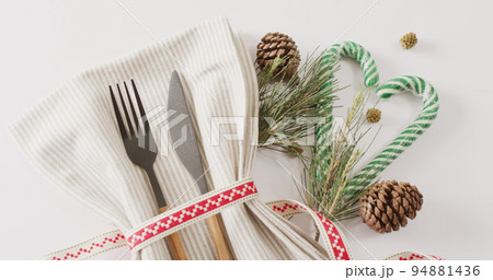 Image of christmas place setting with cutlery and copy space on white background 94881436