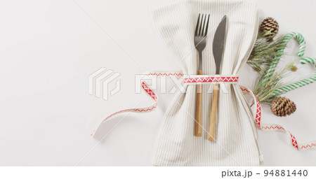 Image of christmas place setting with cutlery and copy space on white background 94881440