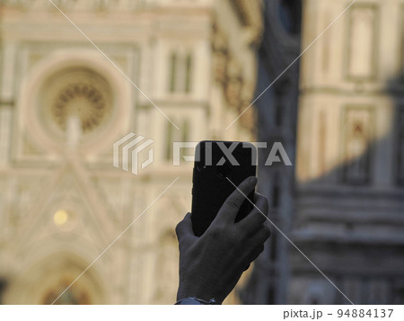 selfie with mobile in Florence dome santa maria del fiore detail 94884137