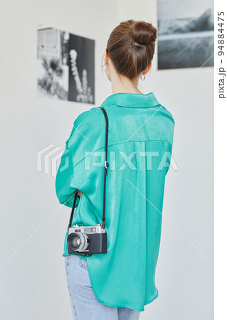 Woman in Art Gallery Back View 94884475