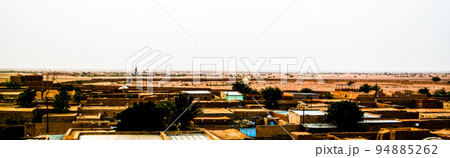 Aerial sunrise panoramic view to Agadez old city, Air, Niger Aerial sunrise panoramic view to Agadez old city, Air, Niger 94885262