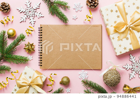 Christmas blank greeting card mock-up scene. Creative layout made of Christmas tree branches and paper card note. Flat lay. Nature New Year concept 94886441