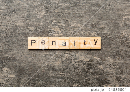 PENALTY word written on wood block. PENALTY text on cement table for your desing, concept PENALTY word written on wood block. PENALTY text on cement table for your desing, concept 94886804