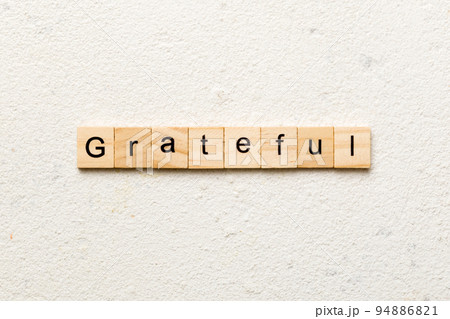 Grateful word written on wood block. Grateful text on table, concept Grateful word written on wood block. Grateful text on table, concept 94886821