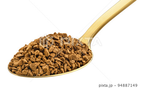 Instant coffee in gold spoon isolated on white background Instant coffee in gold spoon isolated on white background 94887149