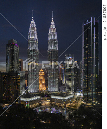 Kuala Lumpur, Malaysia, July 10, 2022 - Twin Towers at night illuminated Kuala Lumpur, Malaysia, July 10, 2022 - Twin Towers at night illuminated 94887807