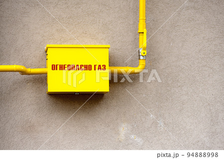 Russian gas box, arm and pipe and text Flammable Gas dirty wall Russian gas box, arm and pipe and text Flammable Gas dirty wall 94888998