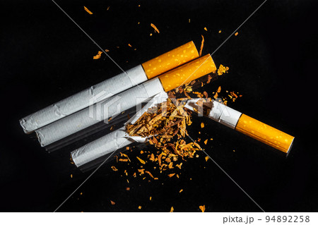 World No Tobacco Day, Broken cigarette isolated on black background. No smoking concept World No Tobacco Day, Broken cigarette isolated on black background. No smoking concept 94892258