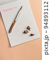 High angle view of notebook or personal diary with handwritten text "Gratitude list", pen and rosebuds. Wellness. Selfcare. Gratitude journal. Mindfulness practice. Selective focus. 94893112
