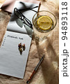High angle view of notebook or personal diary with handwritten text "Gratitude list", pen, water with lemon, grasses. Wellness. Selfcare. Gratitude journal. Mindfulness morning practice. Selective 94893118