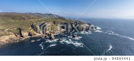 Aerial view of the rocks in the sea at Crohy Head Sea Arch, County Donegal - Ireland. 94893441