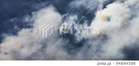 BC Forest Fire and Smoke over the mountain near Hope during a hot sunny summer day. British Columbia 94894506