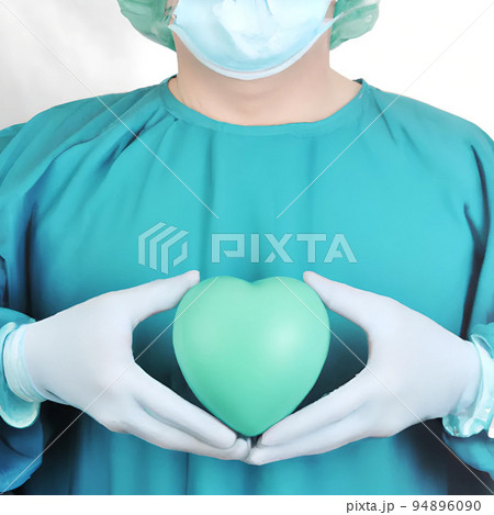 Surgeon holding a green hearth Surgeon holding a green hearth 94896090