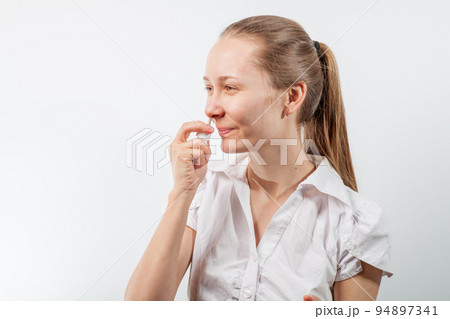 drops in the nose from a cold in a young girl drops in the nose from a cold in a young girl 94897341