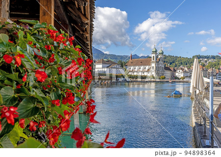 View along the flower-covered Chapel Bridge in Lucerne View along the flower-covered Chapel Bridge in Lucerne 94898364