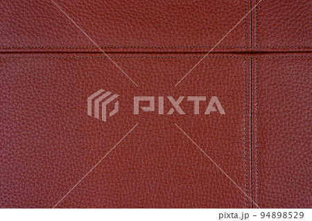 Red leather, leatherette texture background wtih decorative stich 94898529