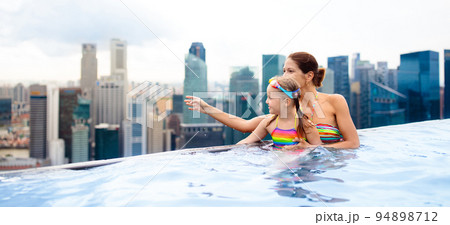 Kids swim in Singapore roof top swimming pool 94898712
