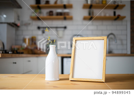 empty frame on modern kitchen table mock up space for your text empty frame on modern kitchen table mock up space for your text 94899345