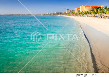 Aruba idyllic caribbean palm beach at sunny day, Dutch Antilles, Caribbean Sea 94899808
