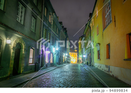 Warsaw's Old Town illuminated street at night, Poland, Eastern europe 94899834