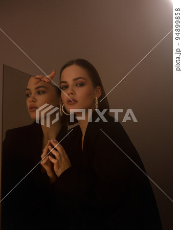 Fashion photography. A beautiful girl in a black Fashion photography. A beautiful girl in a black 94899858