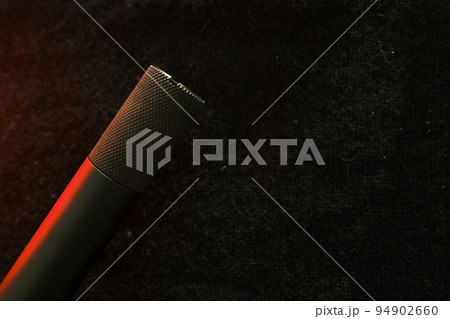 Muzzle of shotguns. Shotgun - macro shooting. Muzzle end of the barrel on a black cloth background. Hunting rifle Muzzle of shotguns. Shotgun - macro shooting. Muzzle end of the barrel on a black cloth background. Hunting rifle 94902660