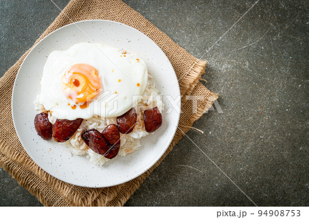 rice with fried egg and Chinese sausage 94908753