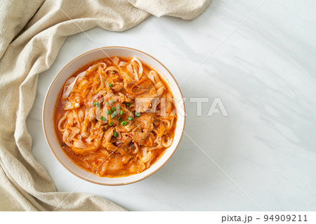 Korean udon ramen noodles with pork in kimchi soup Korean udon ramen noodles with pork in kimchi soup 94909211
