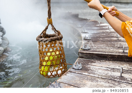 Cook corn and egg inside basket in hot spring at Jioujhihze of Taipingshan in Taiwan Cook corn and egg inside basket in hot spring at Jioujhihze of Taipingshan in Taiwan 94910855