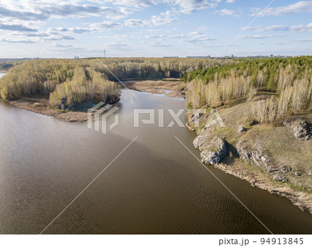 Confluence of the Iset and Kamenka rivers in the city Kamensk-Uralskiy. Iset and Kamenka rivers, Kamensk-Uralskiy, Sverdlovsk region, Ural mountains, Russia. Aerial view Confluence of the Iset and Kamenka rivers in the city Kamensk-Uralskiy. Iset and Kamenka rivers, Kamensk-Uralskiy, Sverdlovsk region, Ural mountains, Russia. Aerial view 94913845
