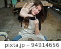 Beautiful woman making ceramic pottery on wheel, close-up. woman in freelance, business, hobby. 94914656