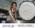 Beautiful woman making ceramic pottery on wheel, close-up. woman in freelance, business, hobby. 94914661