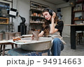 Beautiful woman making ceramic pottery on wheel, close-up. woman in freelance, business, hobby. 94914663
