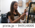 Beautiful woman making ceramic pottery on wheel, close-up. woman in freelance, business, hobby. 94914666