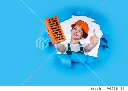 protect head on construction site. teen girl hold brick. little builder with brick. child is engineer architect. building her future house. happy childhood. kid wear protective helmet. copy space protect head on construction site. teen girl hold brick. little builder with brick. child is engineer architect. building her future house. happy childhood. kid wear protective helmet. copy space 94916111