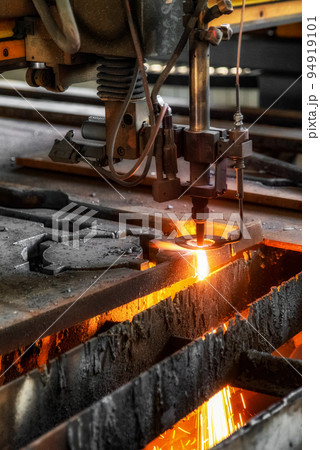 CNC machine cutting the metal plate in workroom by factory. The hi-technology sheet metal manufacturing process 94919101