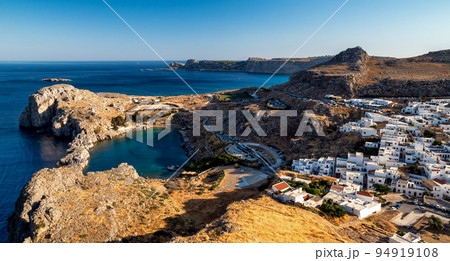 Traditional greek white buildings in town Lindos at Rhodes island in Greece. Sea at background 94919108