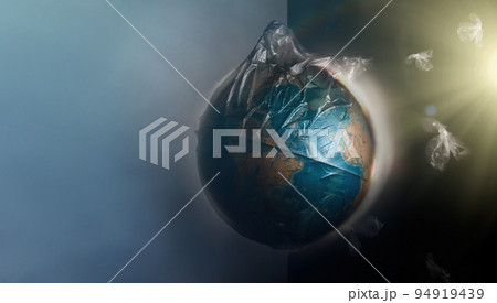 Globe of planet Earth dressed in a garbage plastic bag. Fly around the pieces of broken plastic. The concept of land pollution and ecological imbalance. Copy space 94919439